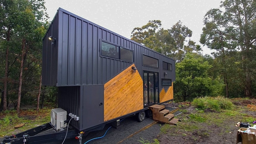 Step inside a gorgeous dual-loft gooseneck tiny house with sophisticated amenities