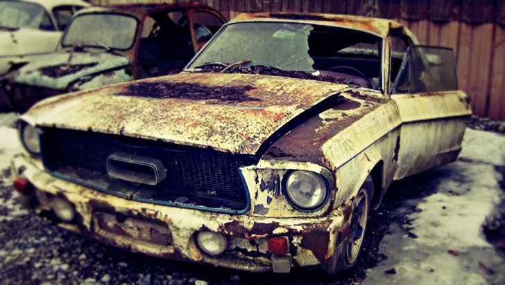 Old rusty Ford Mustang
