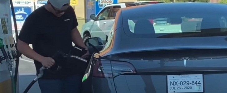 Confused dude tries to fill up his Tesla Model 3 with gas