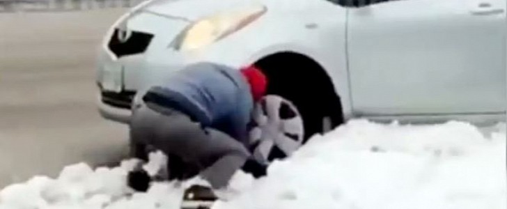 Porch pirate tries to dig his Toyota Yaris out of tiny snowbank