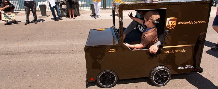 The world's youngest UPS driver in a custom tiny electric UPS truck