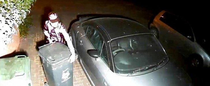 Thief takes garbage bins, doesn't even glance at parked Audi