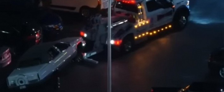 Vehicle getting towed after participating in a street takeover in LA