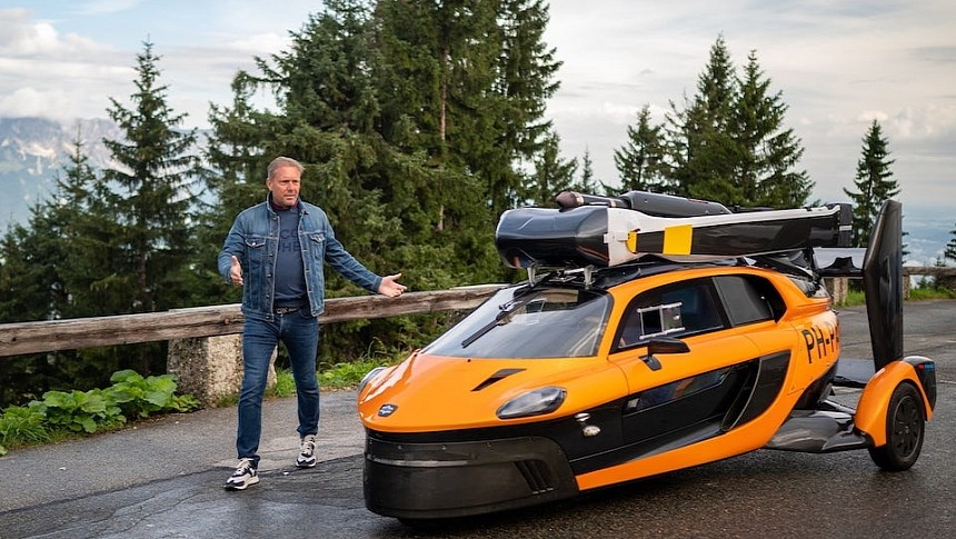 Richard Crombach, regional sales manager DE, next to the Liberty flying car