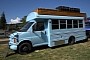 This Beautiful Short Bus Conversion Boasts Gorgeous Woodwork and a Cool Roof Deck