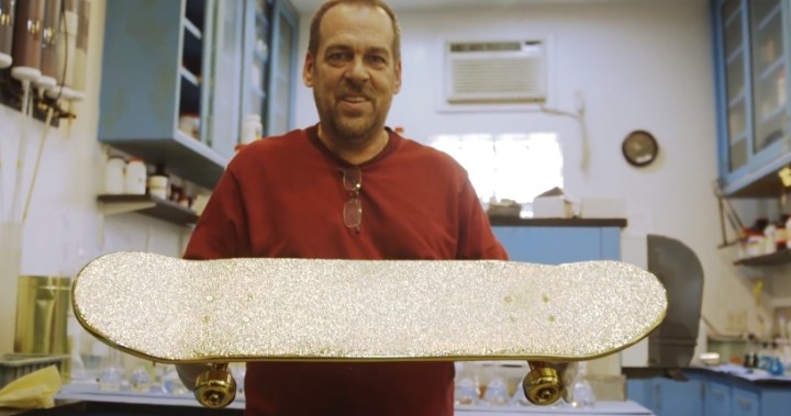 Peter Willet holding the golden skateboard