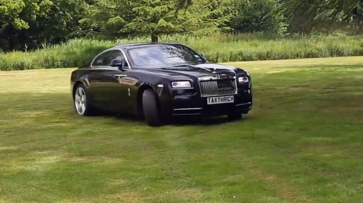Rolls-Royce Wraith drifting in grass