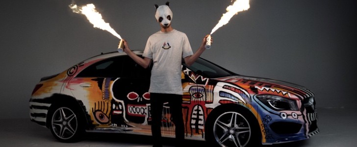 German rapper Cro in front of a Mercedes-Benz CLA 180 he painted