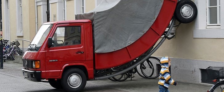 This Leaning Red Mercedes MB100D Truck Got a Parking Ticket 