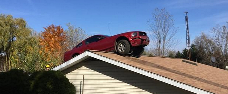 Ford Mustang V6 parked on the roof of a house