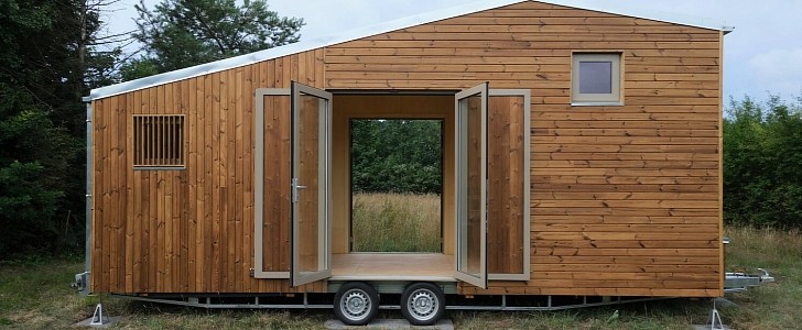 Tiny home opens up to the outside via large glazed doors
