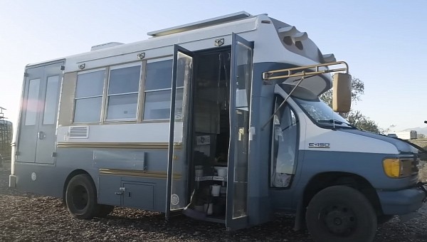 Off grid shuttle bus tiny home converted by a couple