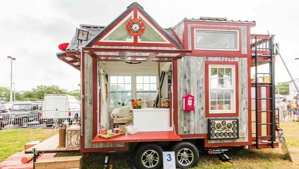Unique little firehouse comes with a slide pole, a fire hydrant, and an outdoor shower