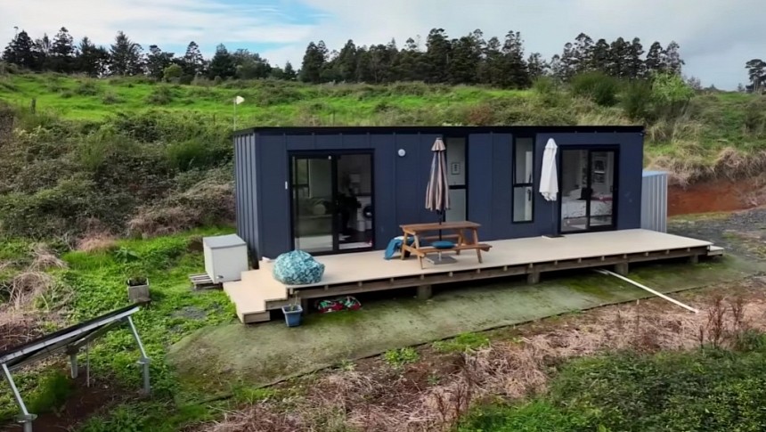 Tiny House with a Downstairs Bedroom, a Large Deck, and a Full Bath