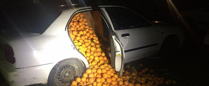 Suzuki Baleno filled with oranges