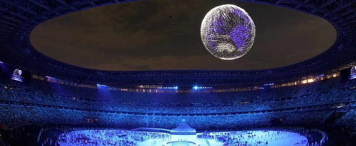 More than 1,800 drones morphed into a giant disco ball above the Tokyo Olympics stadium