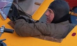 Tom Cruise Casually Hangs Upside Down on the Wing of a Flying Boeing Biplane