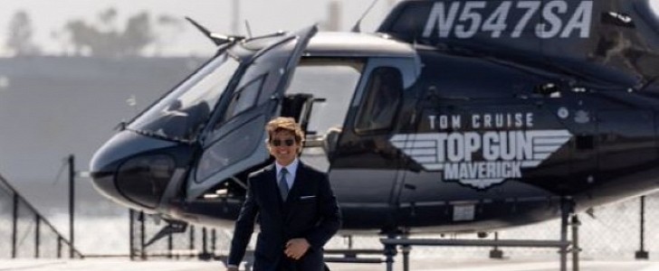 Tom Cruise lands a helicopter on board the USS Midway for the world premiere of Top Gun: Maverick