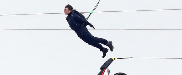 Tom Cruise launches himself and a dirtbike in the air for Mission: Impossible stunt