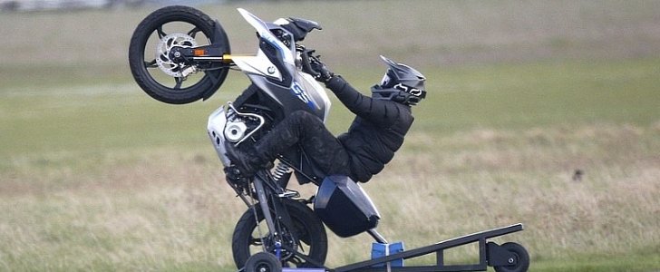 Tom Cruise rides a BMW, pops wheelies on the set of Mission: Impossible 7
