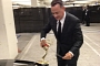 Tom Hanks Tapes Emmy Award to Hood of a Lincoln