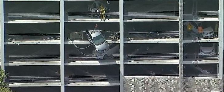 Silver Honda Civic dangles off Santa Monica parking structure in movie-like incident