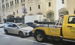 Tow Truck Tries To Hook Toyota While Waiting at the Light, Couple Is Left Shaken