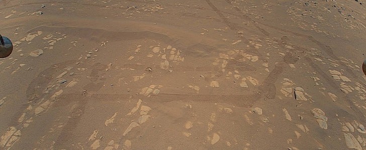 Shot of Mars taken by Ingenuity from above 
