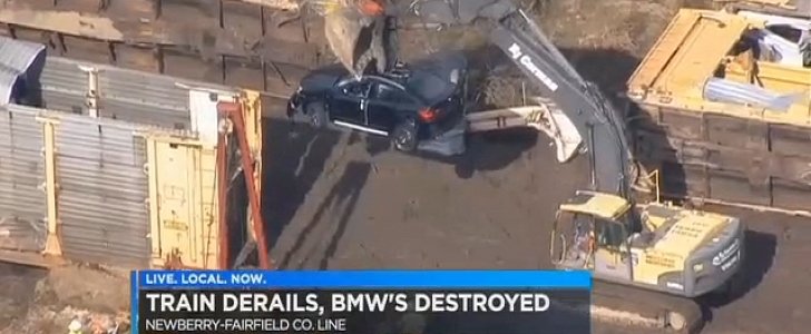 Train carrying BMWs derails