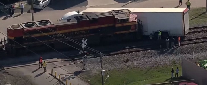 Train slams into semi-truck carrying exotics, stuck on the tracks in Houston, TX 