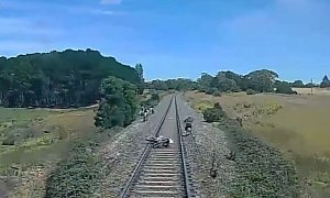 Train Smashes Dirtbike Stranded On The Tracks, Rider Barely Escapes