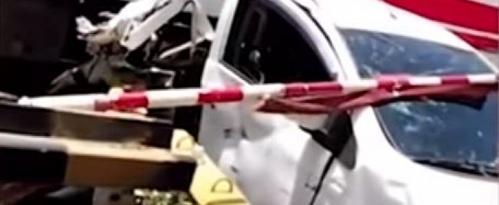 Train smashes into car as female driver nods off at the wheel in Taiwan