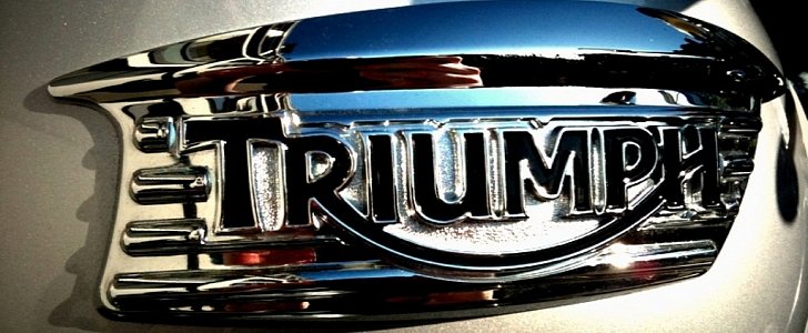 Triumph metal badge
