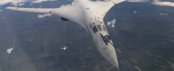 Two strategic missile carriers Tu-160 perform refueling during flight over the Arctic Ocean