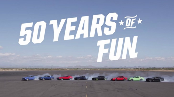Eight Ford Mustangs drifting