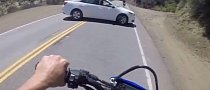 Two Riders Almost Smash Into U-Turning Car