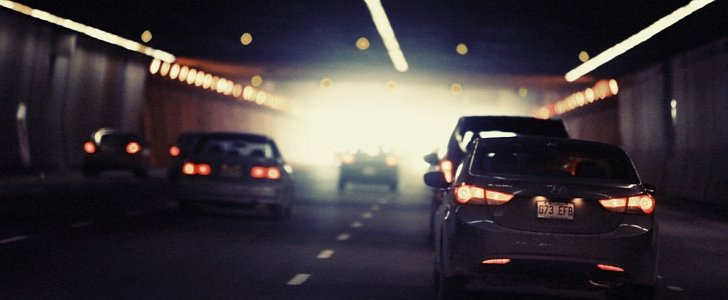 Cars entering a tunnel