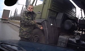 Ukrainian Soldier Almost Killed by a Car, Has No Reaction <span>· Video</span>