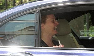 Uma Thurman Looks Happy to Ride in BMW 7 Series