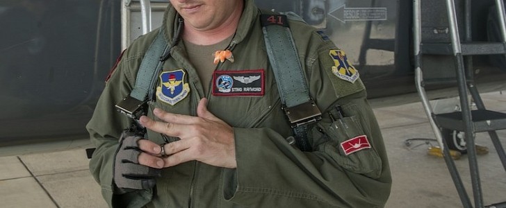 U. S. Air Force Capt. Nathan Raymond, an instructor pilot assigned to the 435th Fighter Training Squadron, removes his Oura Ring before a flight