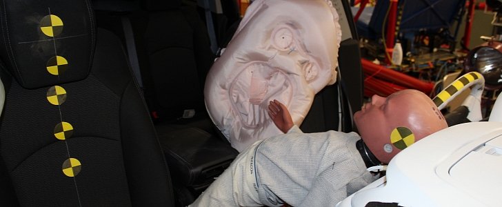 Front-center airbag of a 2013 Chevrolet Traverse deployed in an static out-of-position test