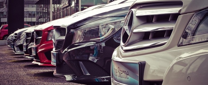 Assortment of Mercedes-Benz models in dealer parking lot