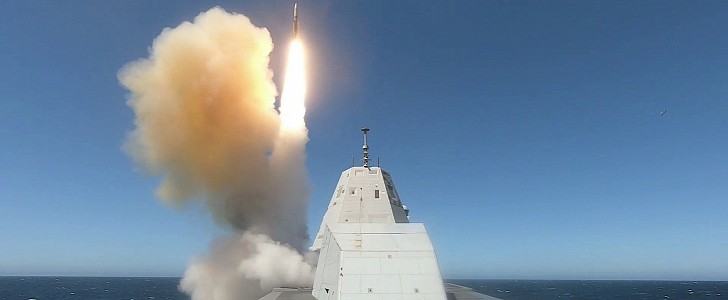 USS Zumwalt firing missiles at live targets