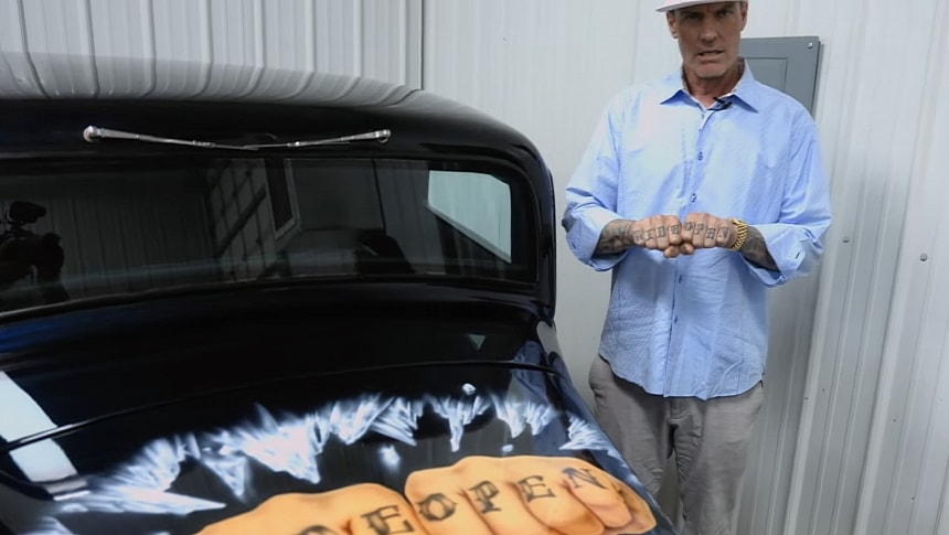 Vanilla Ice and the car that has his portrait airbrushed on the tailgate