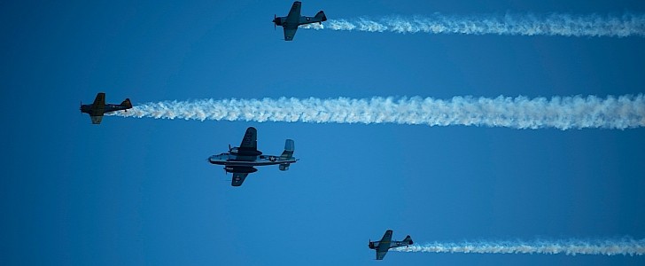 WWII aircraft flying Missing Man formation in honor of the Doolittle Raiders