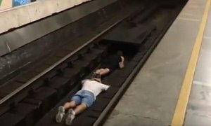 Viral Stunt: Teenagers Lay Down on the Tracks as Subway Train Pulls In