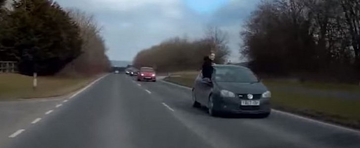 19-year-old driver hangs out of his car window while doing 50mph on a busy road
