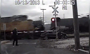 W211 E-Class Hits Train, Gets Hit by Another Train