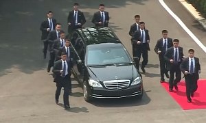 Watch 12 Bodyguards Run Alongside Kim Jong-un's Mercedes Limo