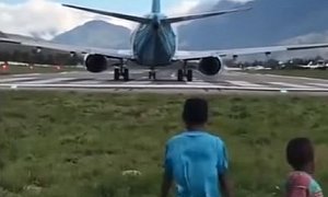 Watch 2 Kids Getting Knocked Over by Wind From a Jet Plane